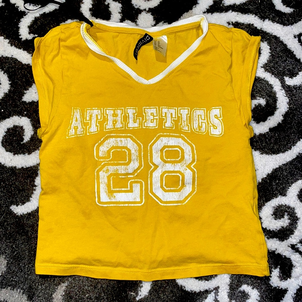 Divided, XS yellow shirt with athletics and a number on the front